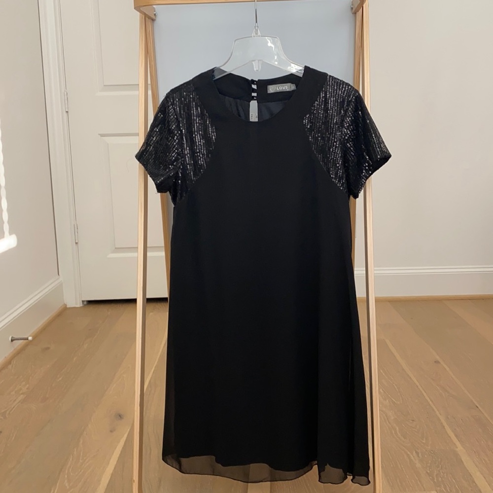 Black shift dress with sequin sleeves